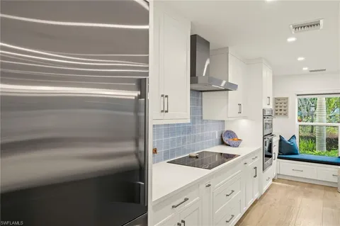 a bathroom with a sink a bathtub and window