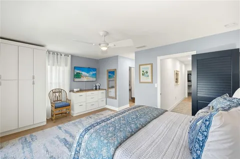 a bedroom with a bed and a chair