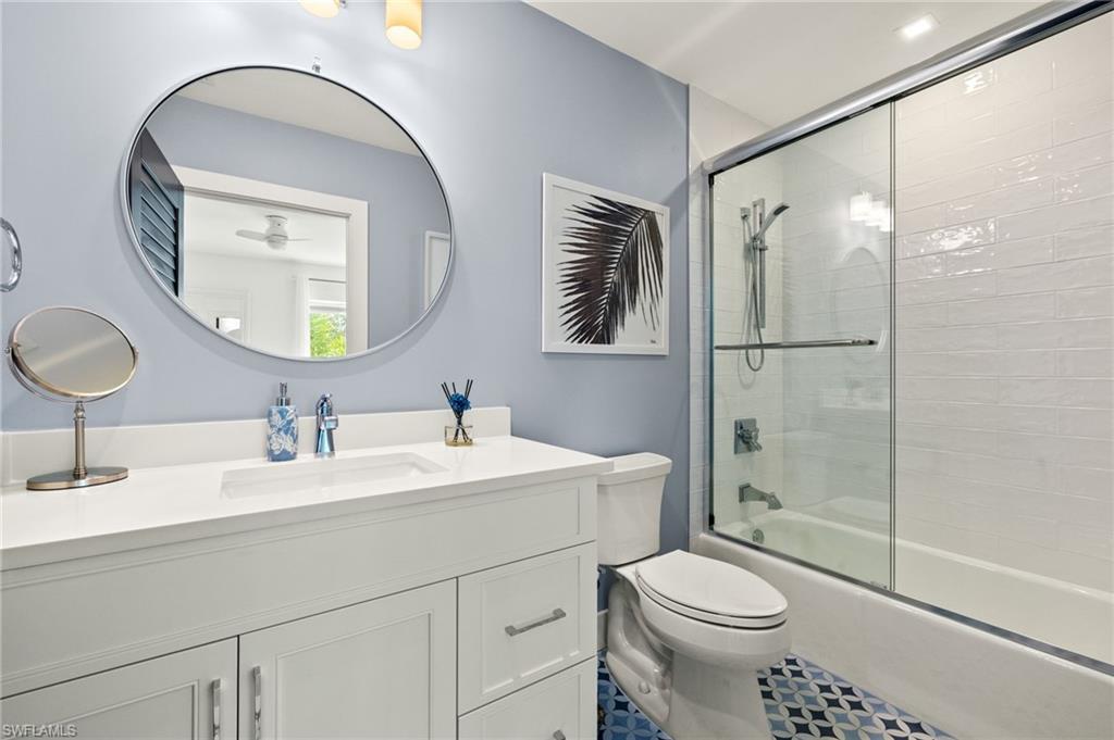 1060 6th Street South, Unit 1060 Naples, FL 34102 - Photo 24 of 26 a bathroom with a sink toilet and shower