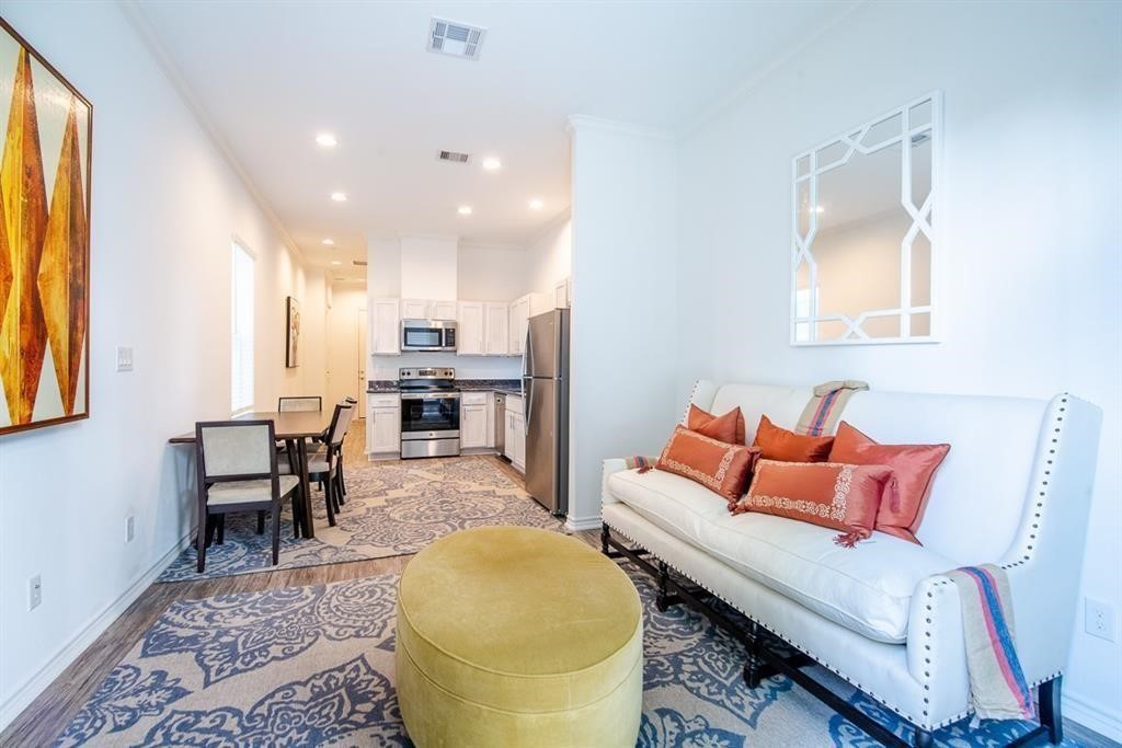 2524 Sam Wilson Street Houston, TX 77020 - Photo 2 of 6 a living room with furniture and a fireplace