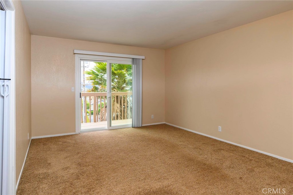 171 Brisco Road, Unit 8 Arroyo Grande, CA 93420 - Photo 6 of 23 an empty room with an outdoor view and a window