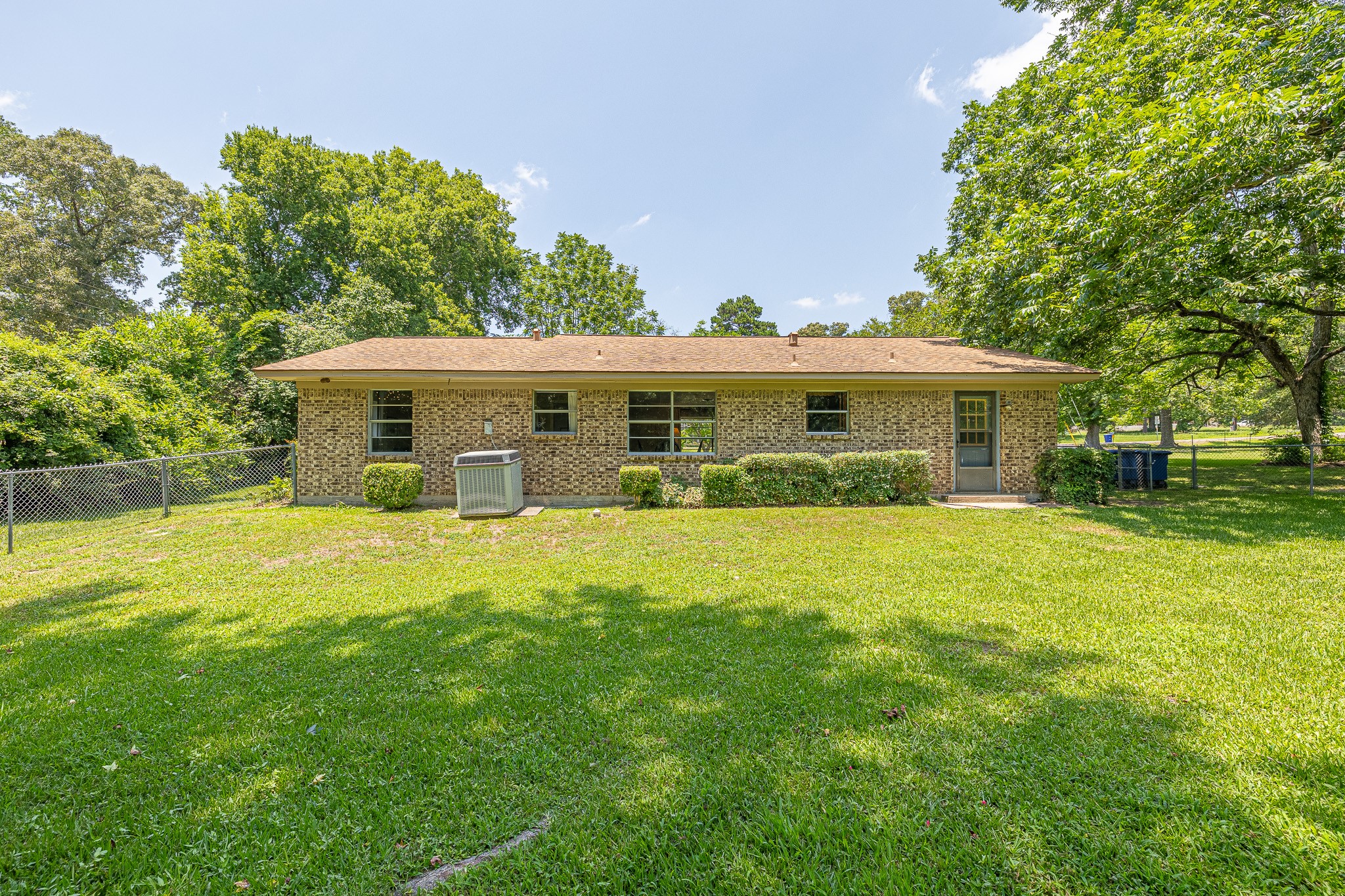 1009 Fish Hatchery Road Huntsville, TX 77320 - Photo 3 of 16 a front view of a house with a yard