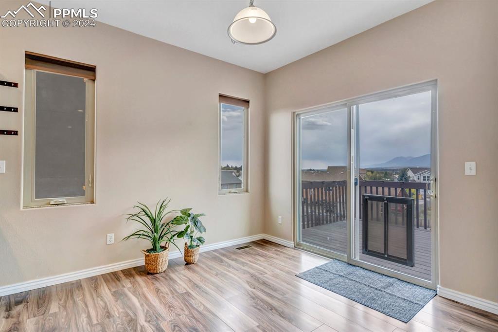 861 Circle Road Palmer Lake, CO 80133 - Photo 11 of 41 a view of livingroom with entryway and wooden floor