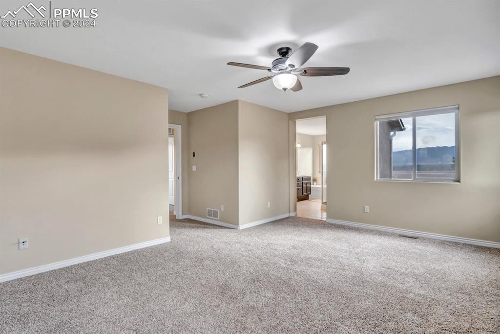 861 Circle Road Palmer Lake, CO 80133 - Photo 17 of 41 a view of an empty room with a window
