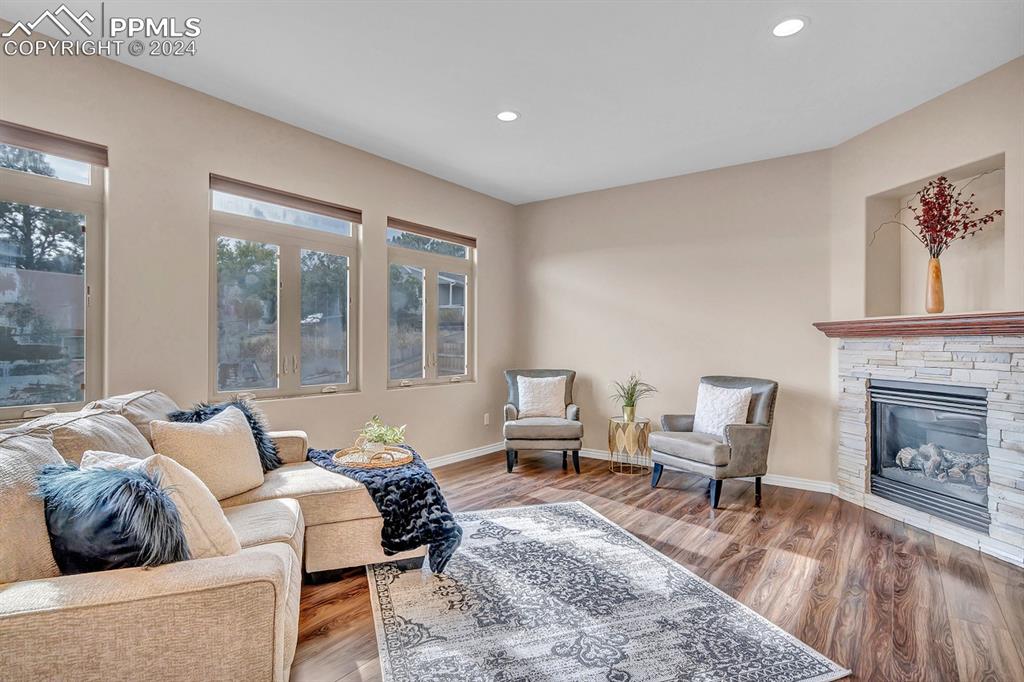 861 Circle Road Palmer Lake, CO 80133 - Photo 2 of 41 a living room with furniture and a fireplace
