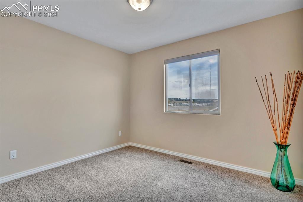 861 Circle Road Palmer Lake, CO 80133 - Photo 22 of 41 an empty room with a window