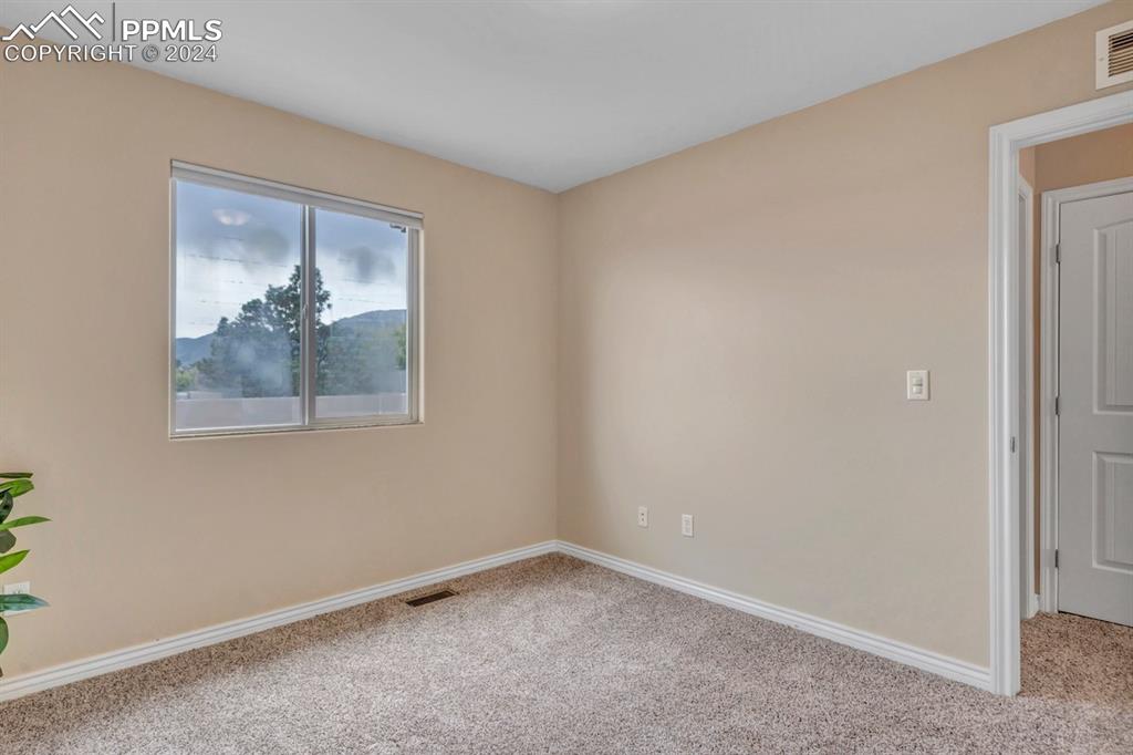 861 Circle Road Palmer Lake, CO 80133 - Photo 25 of 41 a view of a small space with wooden floor and a window