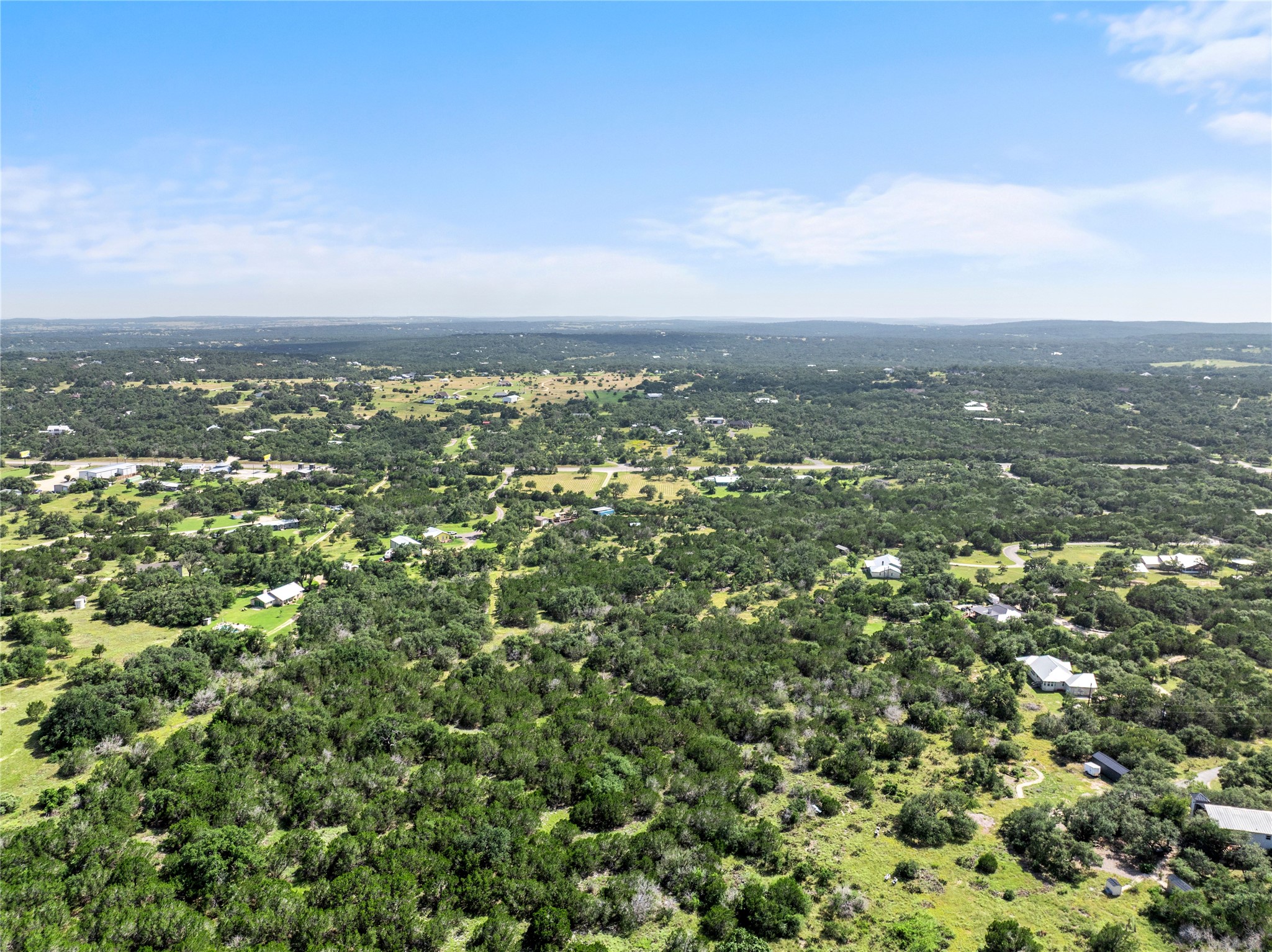 8200 Ranch Road 12 San Marcos, TX 78666 - Photo 37 of 40 Expansive acreage provides a verdant canvas for a private residential enclave.