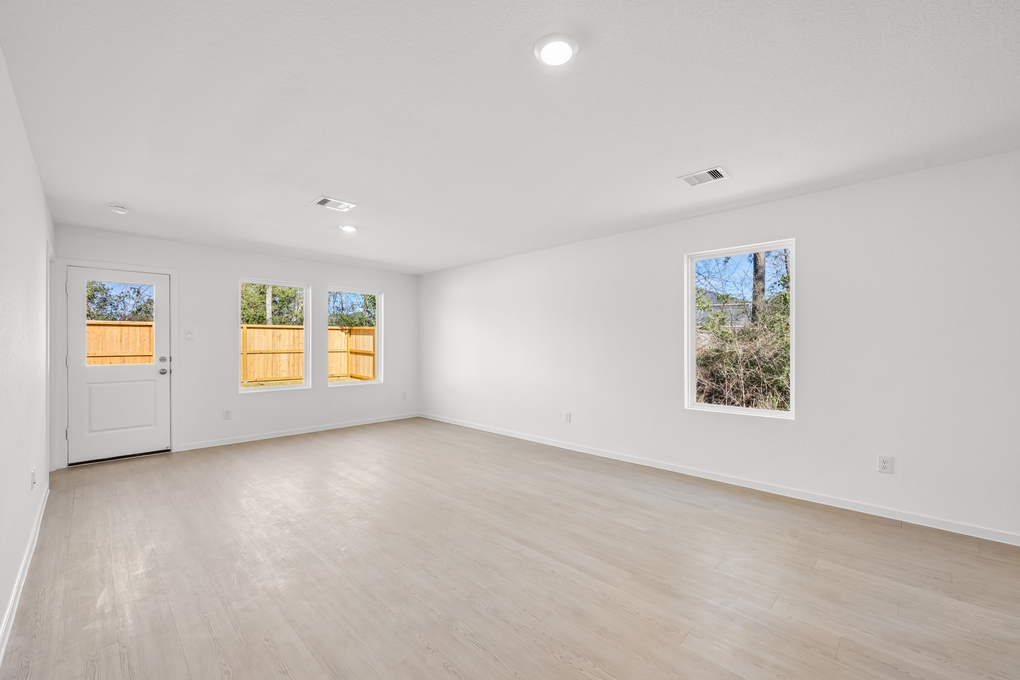 10583 Altitude Way Conroe, TX 77303 - Photo 16 of 33 an empty room with windows