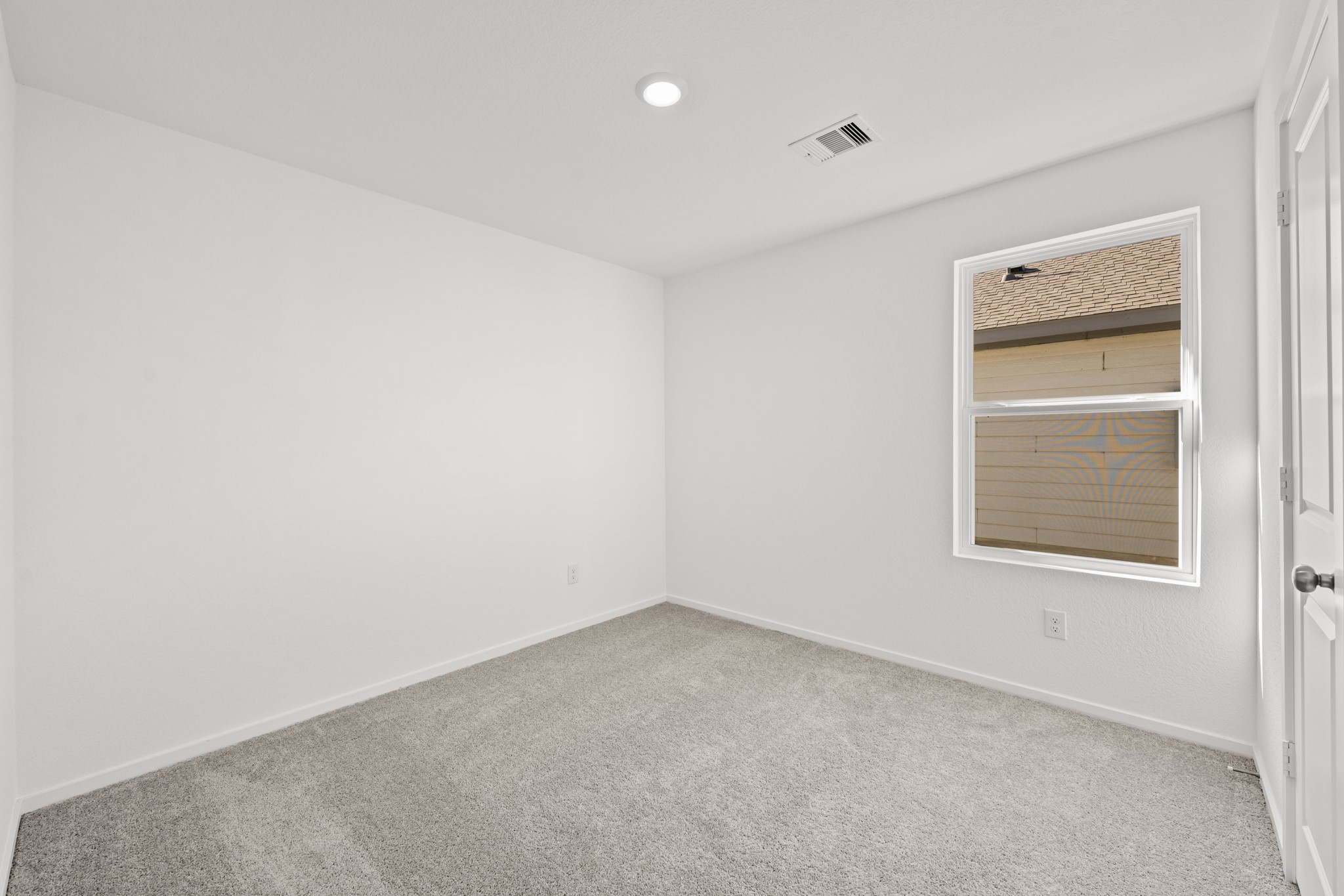 10583 Altitude Way Conroe, TX 77303 - Photo 21 of 33 an empty room with a window