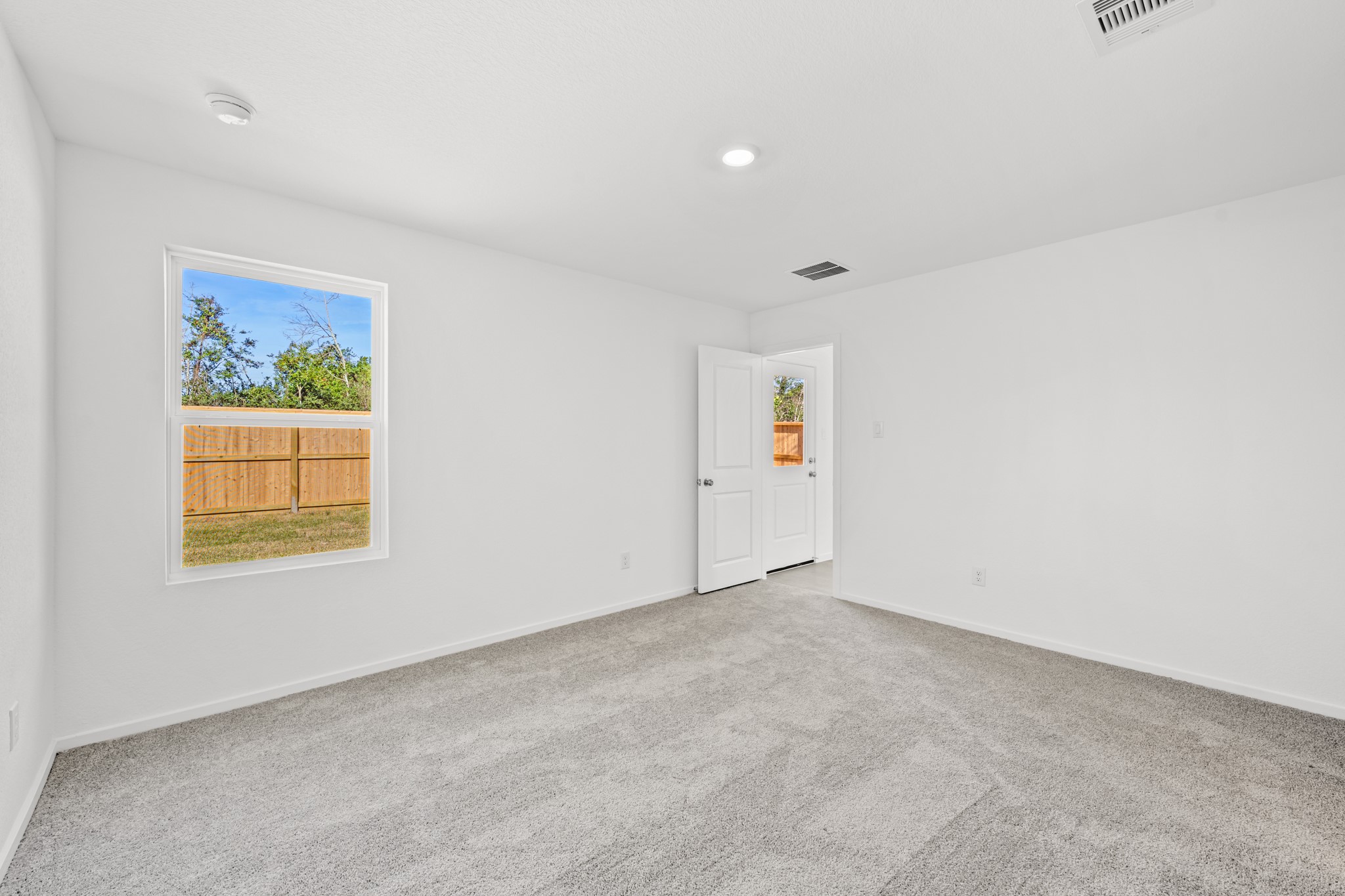10583 Altitude Way Conroe, TX 77303 - Photo 25 of 33 an empty room with windows