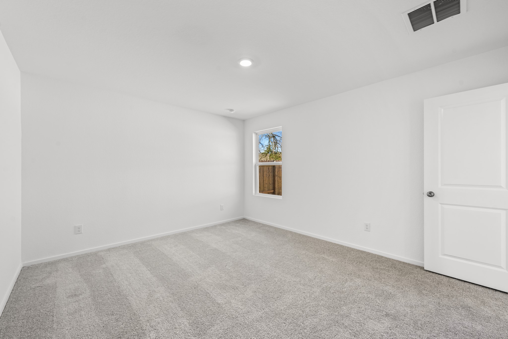 10583 Altitude Way Conroe, TX 77303 - Photo 26 of 33 an empty room with windows