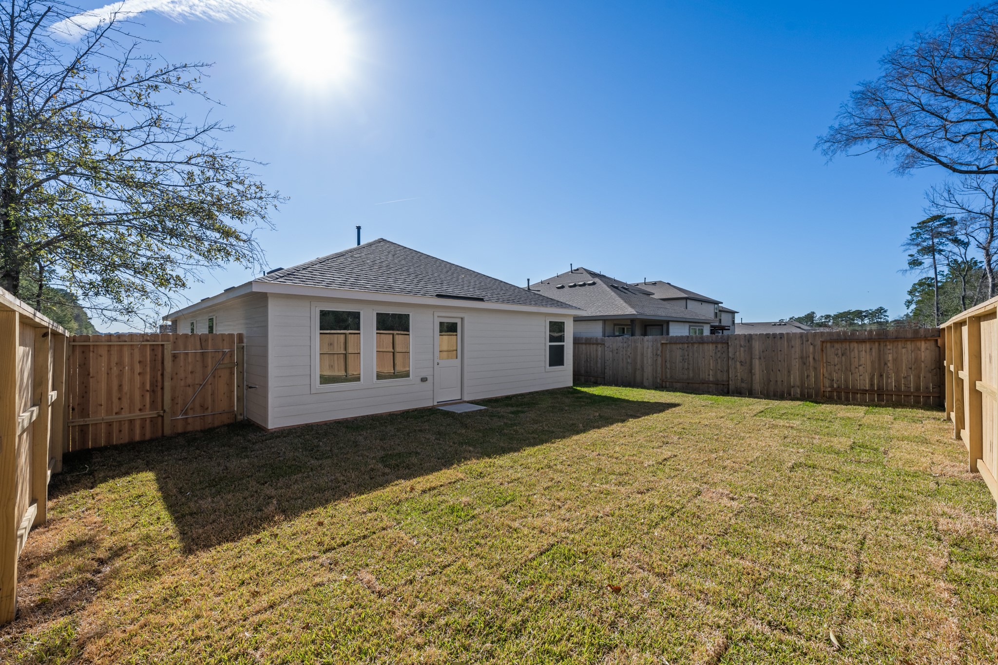10583 Altitude Way Conroe, TX 77303 - Photo 30 of 33 a front view of a house with a yard and garage