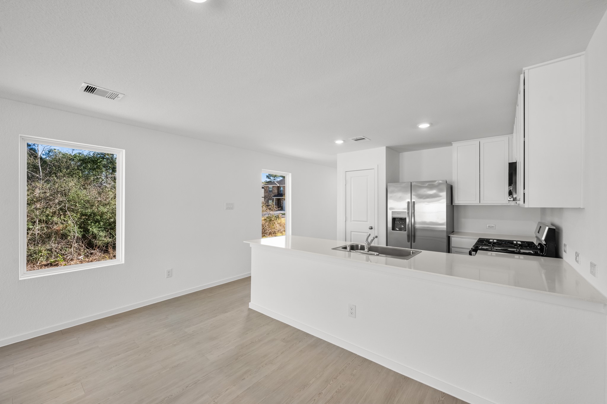 10583 Altitude Way Conroe, TX 77303 - Photo 10 of 33 a view of a kitchen with a sink and a window
