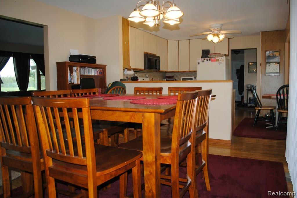 8707 West Van Buren Road Fowlerville, MI 48836 - Photo 7 of 22 Dining room looking into kitchen and living room.