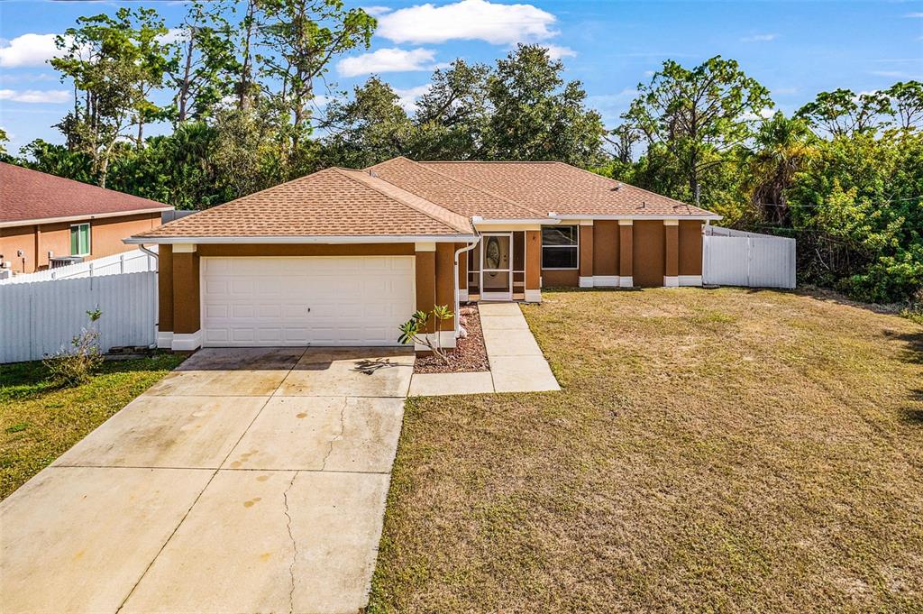 a view of a house with a yard