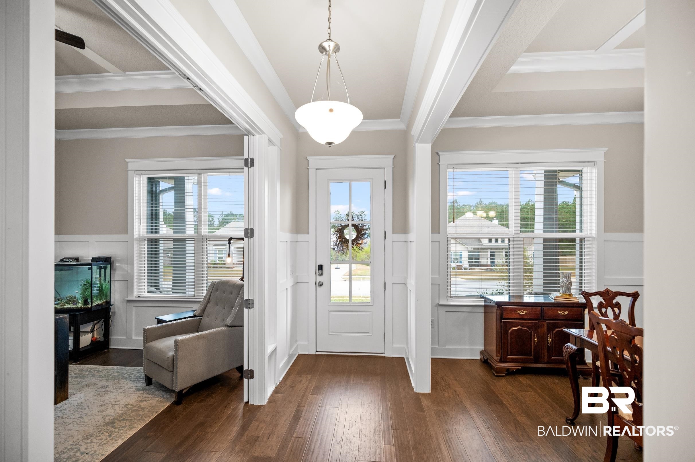 31355 Limpkin Street Daphne, AL 36527 - Photo 5 of 57 Foyer featuring dark hardwood / wood-style floors, a wealth of natural light, and crown molding