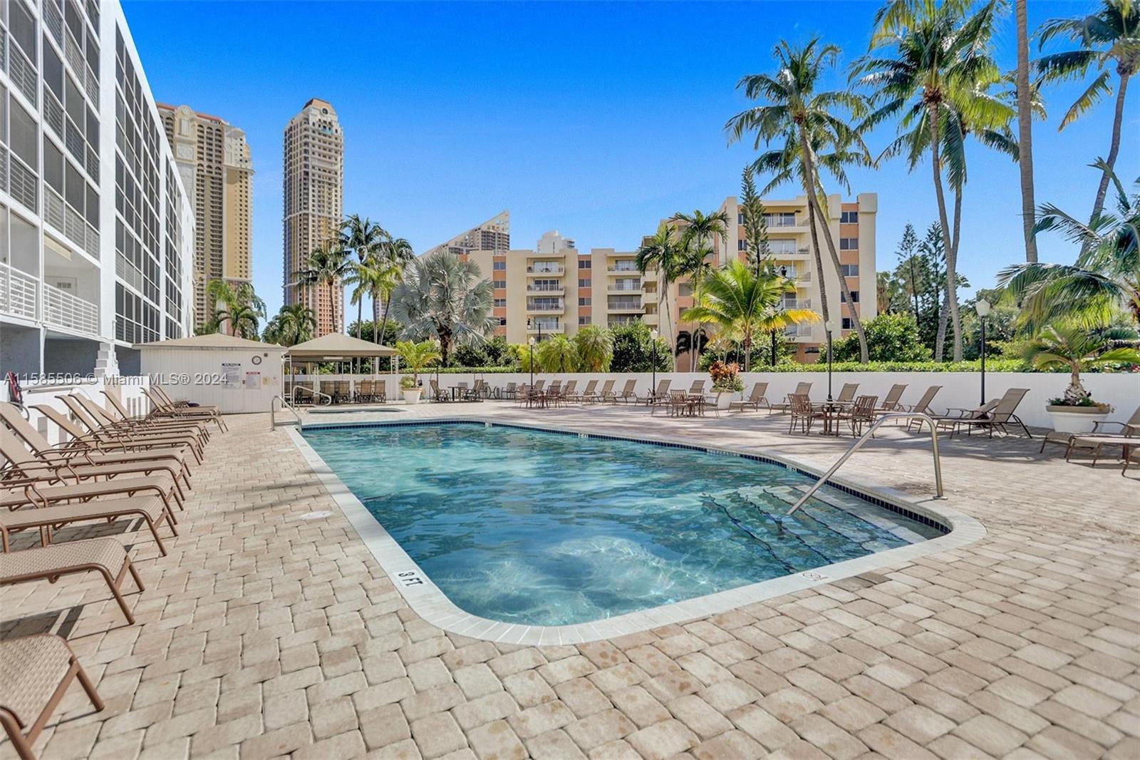 17801 North Bay Road, Unit 303 Sunny Isles Beach, FL 33160 - Photo 16 of 17 a view of a swimming pool with a patio