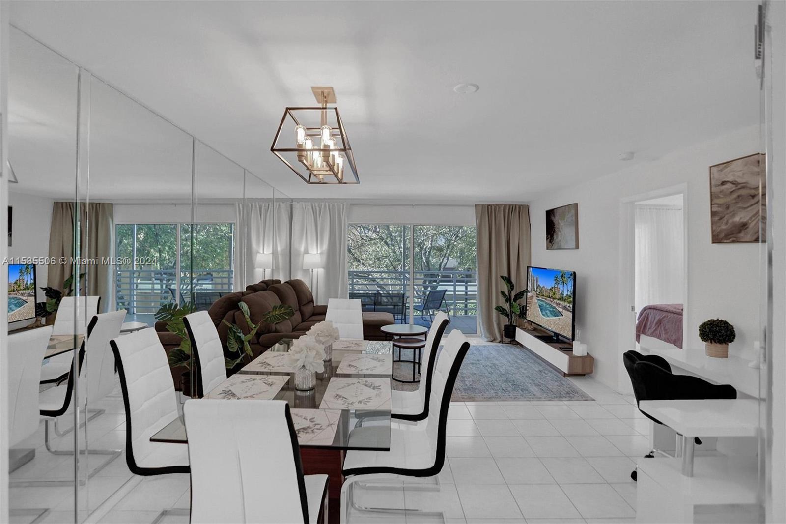 17801 North Bay Road, Unit 303 Sunny Isles Beach, FL 33160 - Photo 5 of 17 a view of a livingroom with furniture window and outside view