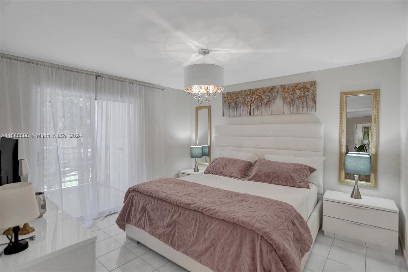 17801 North Bay Road, Unit 303 Sunny Isles Beach, FL 33160 - Photo 7 of 17 a bedroom with a bed and a chandelier