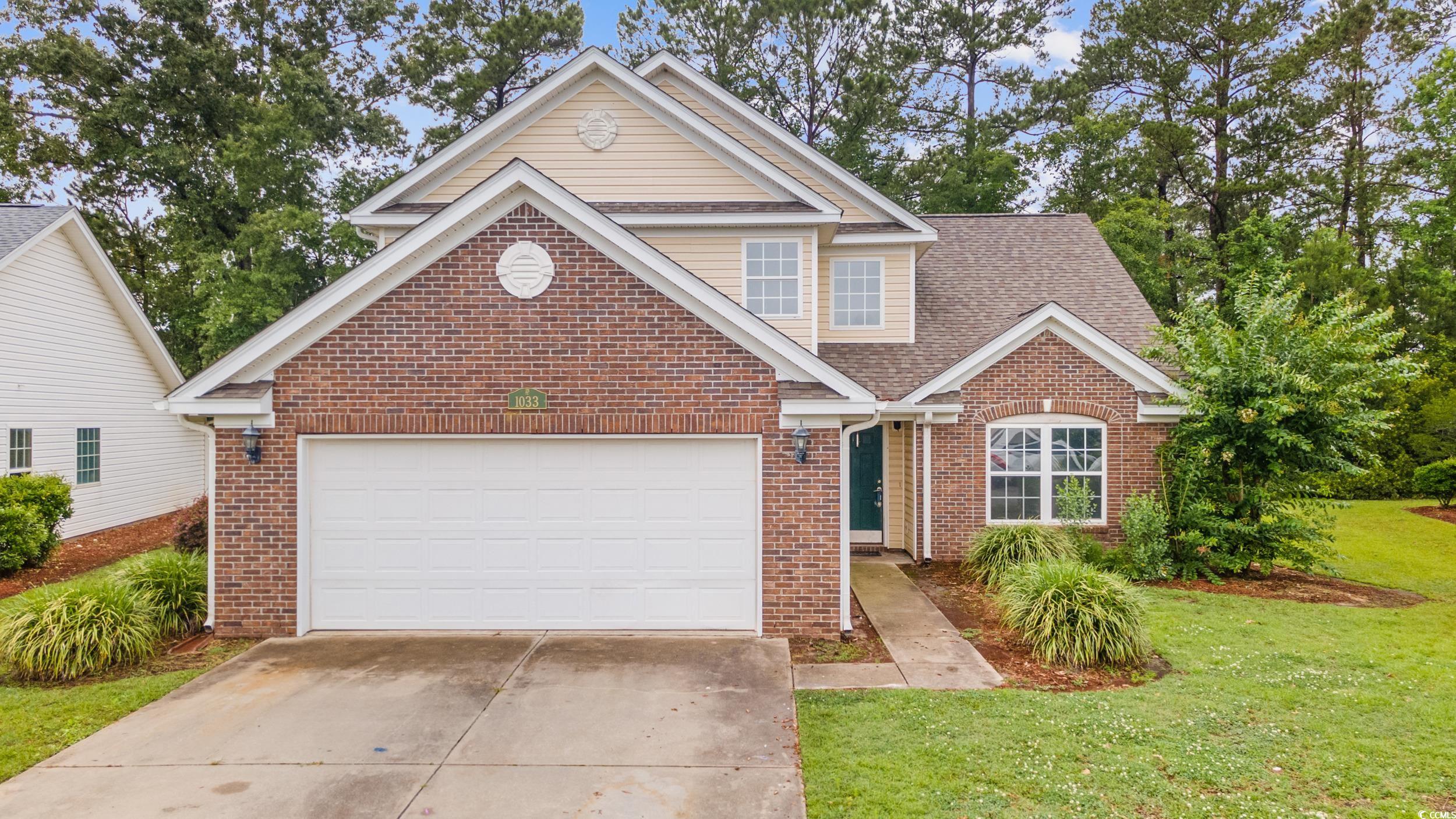 1033 Mccall Loop Conway, SC 29526 - Photo 2 of 40 Traditional-style home with brick siding, concrete