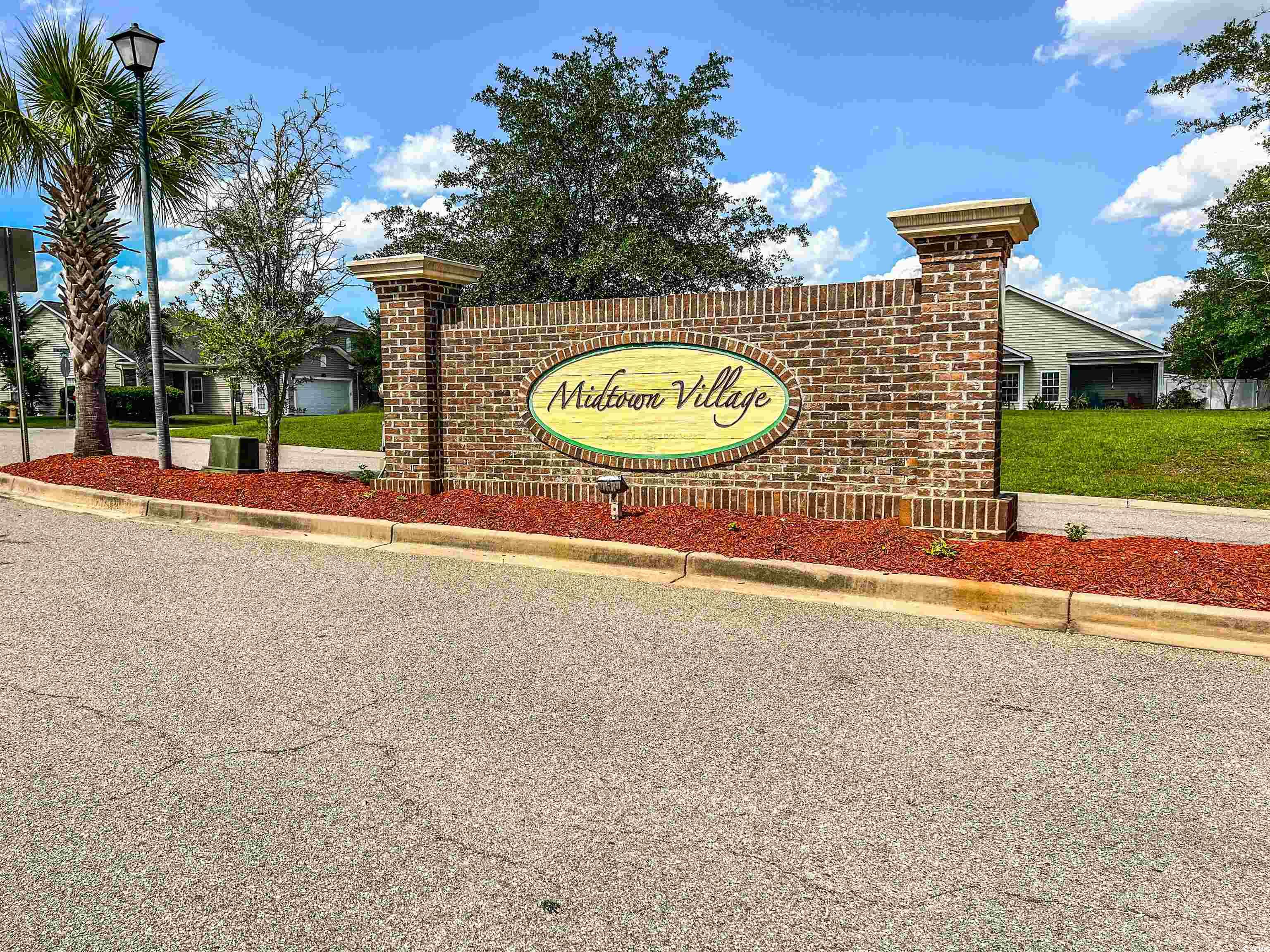 1033 Mccall Loop Conway, SC 29526 - Photo 39 of 40 Community / neighborhood sign with a yard