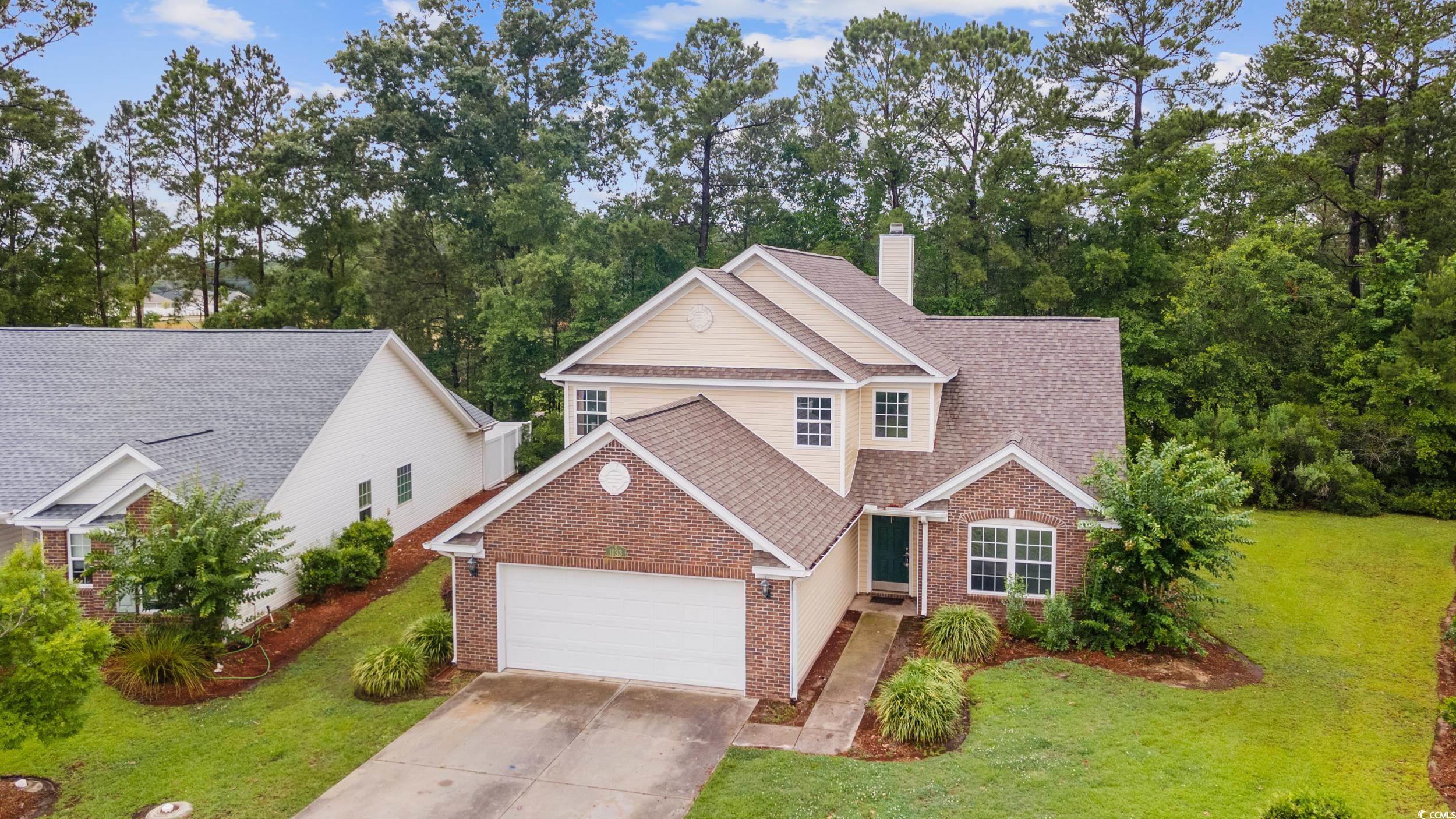 1033 Mccall Loop Conway, SC 29526 - Photo 4 of 40 Traditional home with brick siding, an attached ga