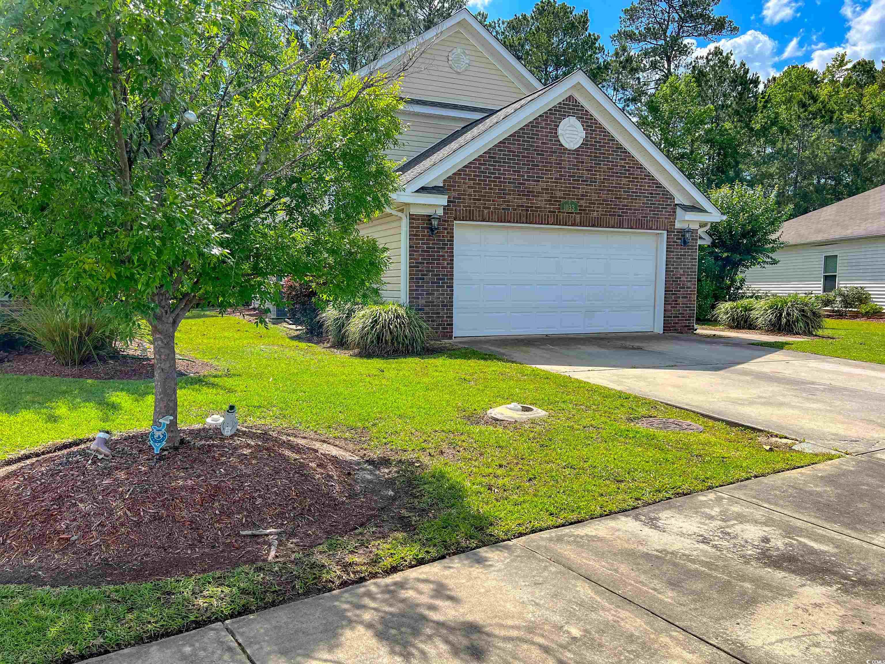 1033 Mccall Loop Conway, SC 29526 - Photo 6 of 40 Traditional home with brick siding, a front yard,