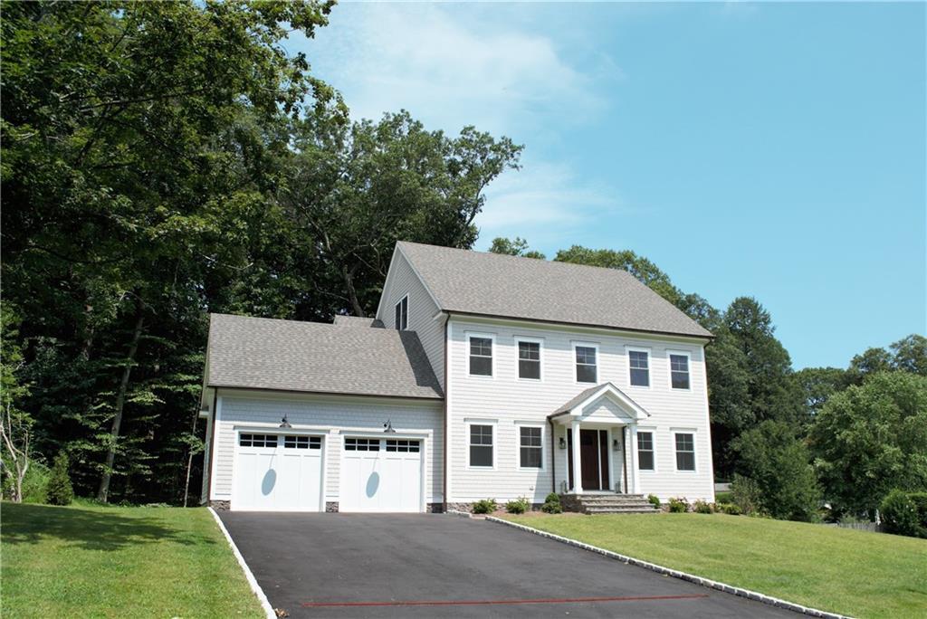 180 Nonopoge Road Fairfield, CT 06825 - Photo 1 of 1 a front view of a house with a yard