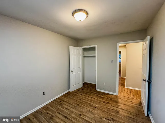 a view of room with wooden floor
