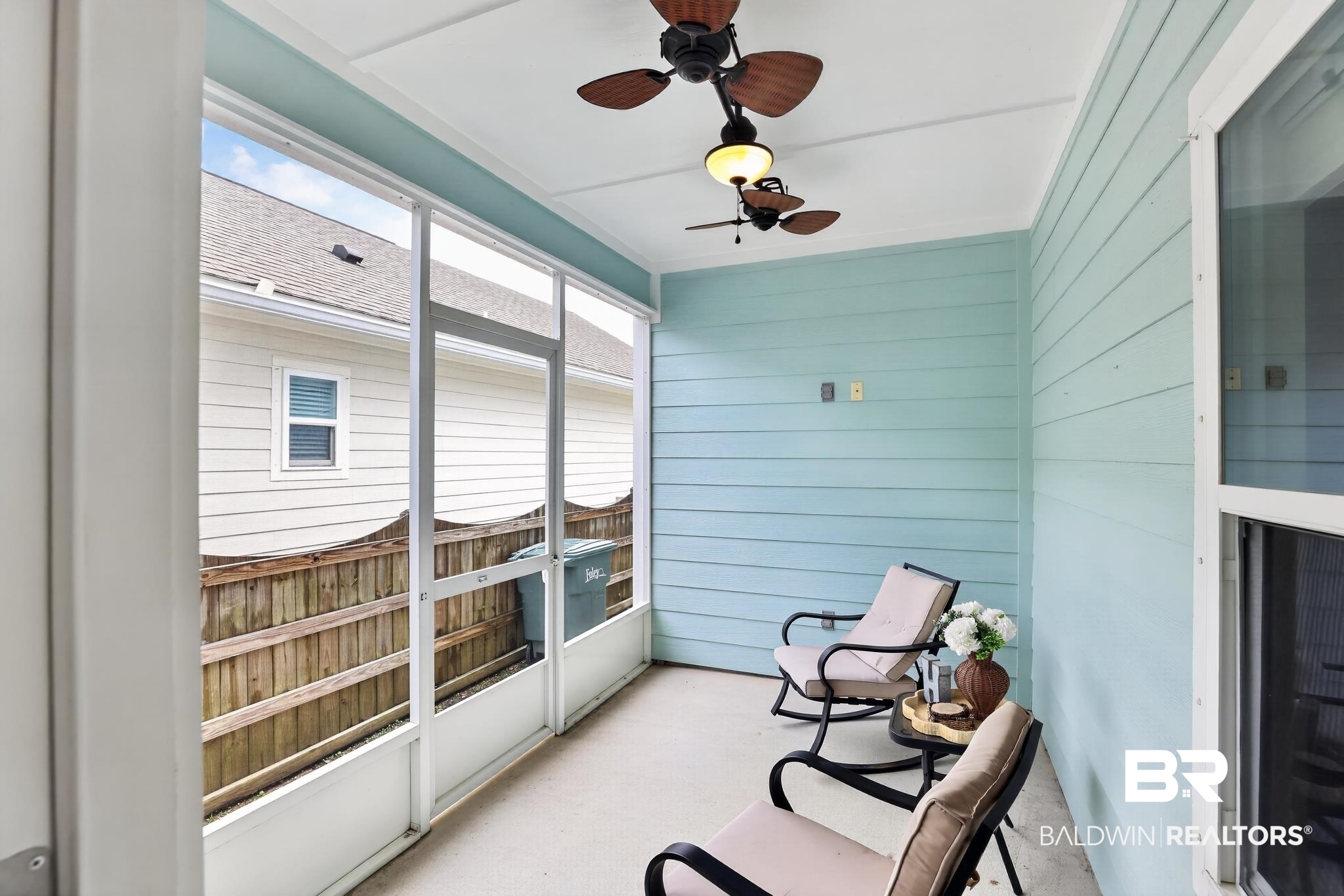 1210 Primrose Lane Foley, AL 36535 - Photo 5 of 33 Screened-in porch featuring a light blue horizontal plank wall