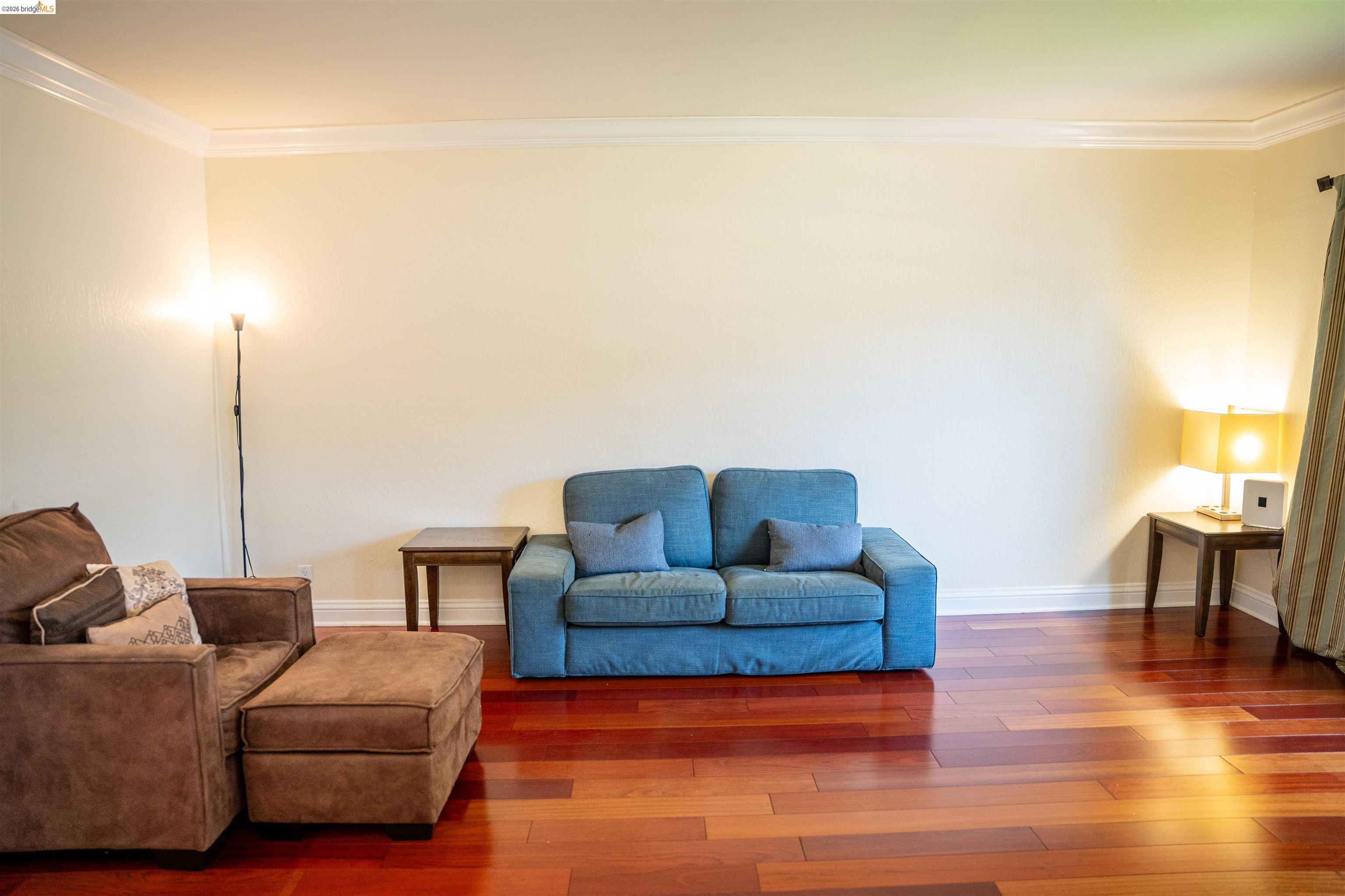 3513 Rio Grande Drive Antioch, CA 94509 - Photo 4 of 22 Spacious room featuring wood-finish flooring, white baseboards, and crown molding