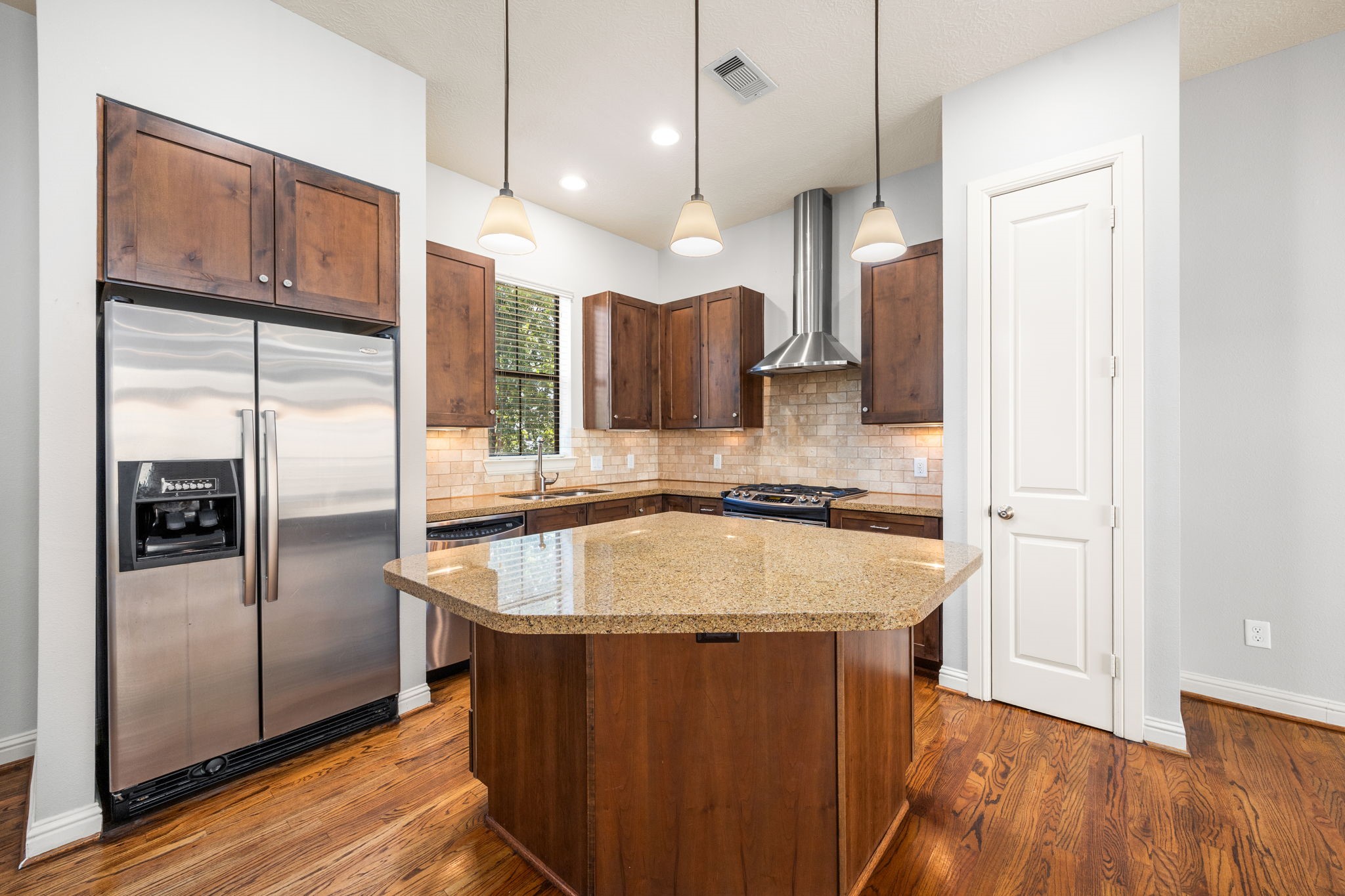 5213 Eigel Street, Unit A Houston, TX 77007 - Photo 14 of 30 a kitchen with stainless steel appliances granite countertop a refrigerator a sink and a refrigerator