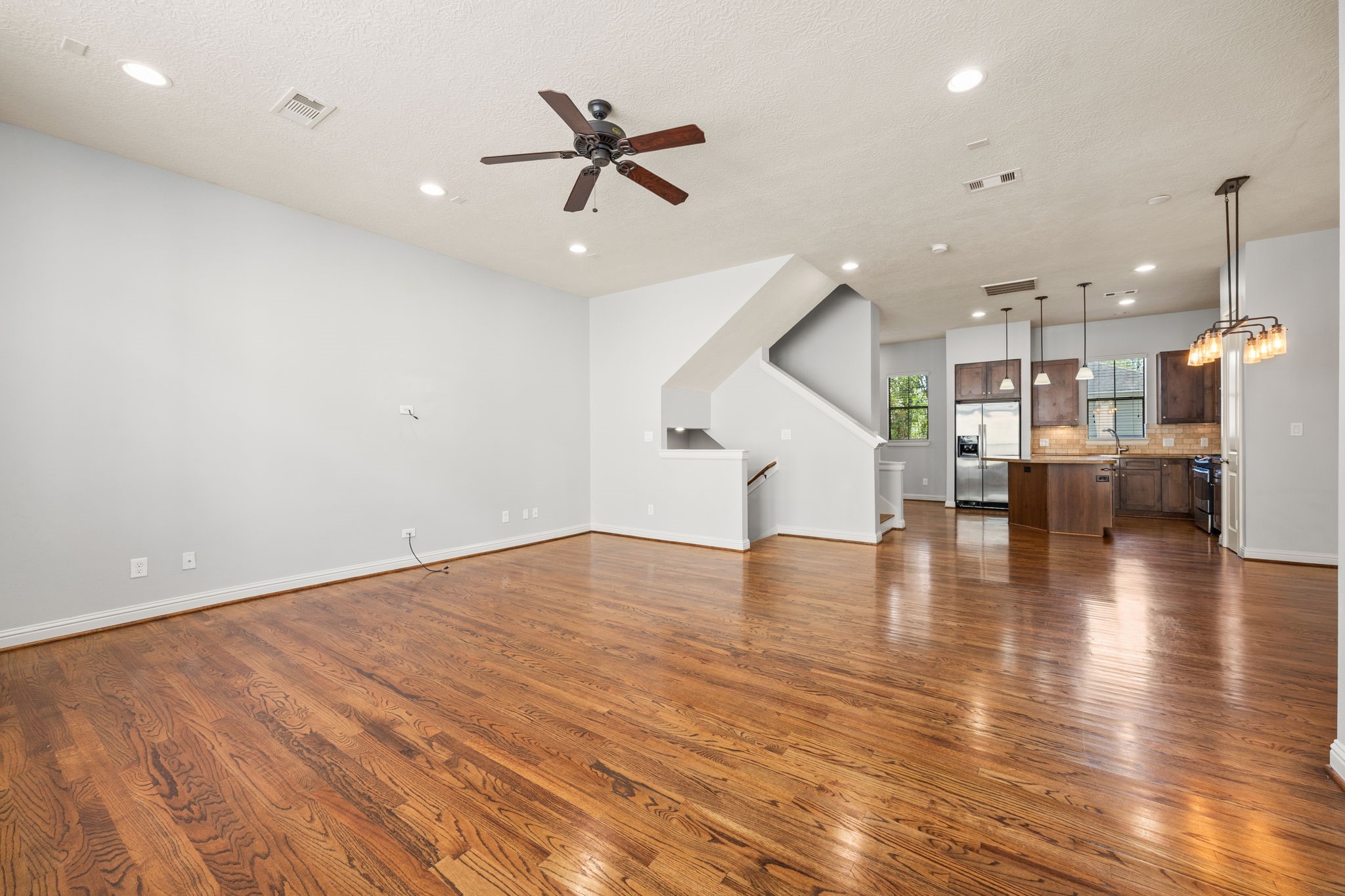 5213 Eigel Street, Unit A Houston, TX 77007 - Photo 9 of 30 a view of a room with kitchen island and wooden floor