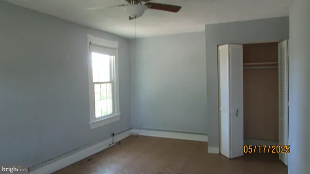 a bathroom with a bathtub and a window