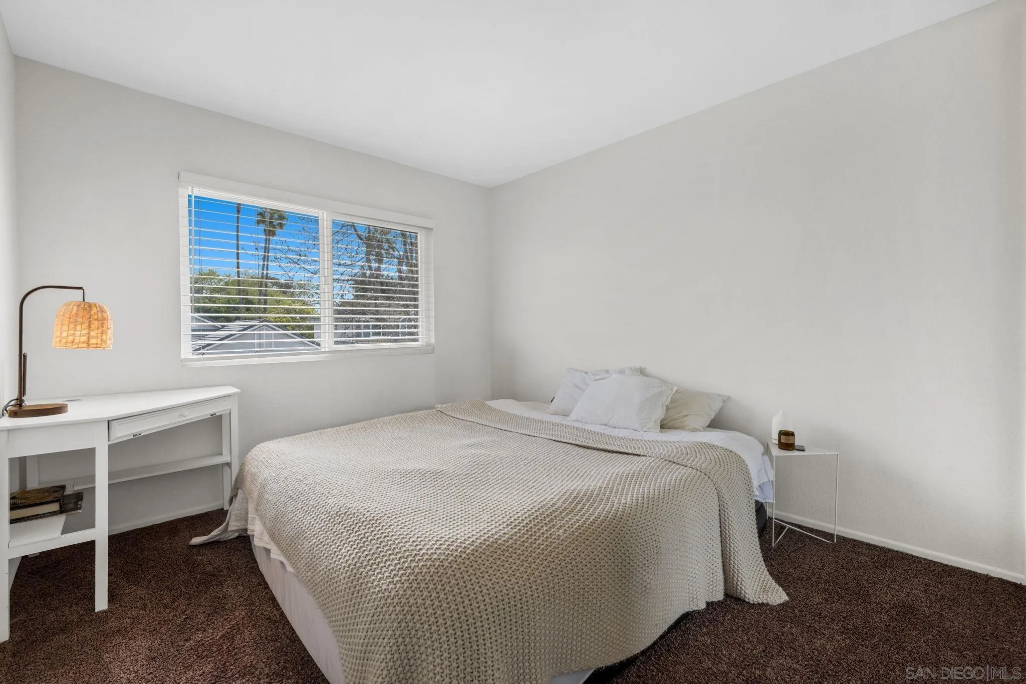5392 Blackberry Way Oceanside, CA 92057 - Photo 23 of 37 a bedroom with a bed a table and windows
