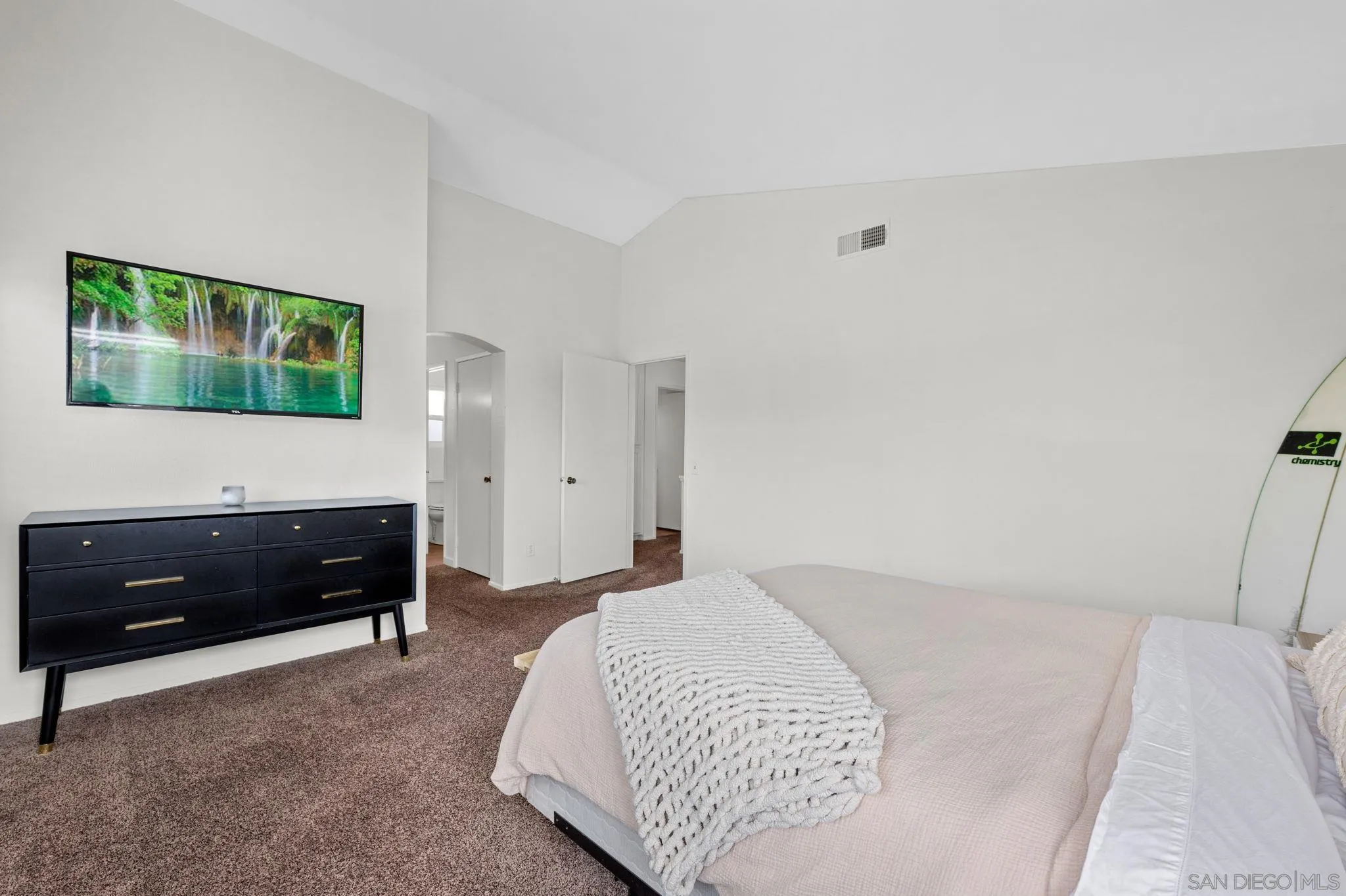 5392 Blackberry Way Oceanside, CA 92057 - Photo 27 of 37 a bedroom with a bed and a flat tv screen on dresser