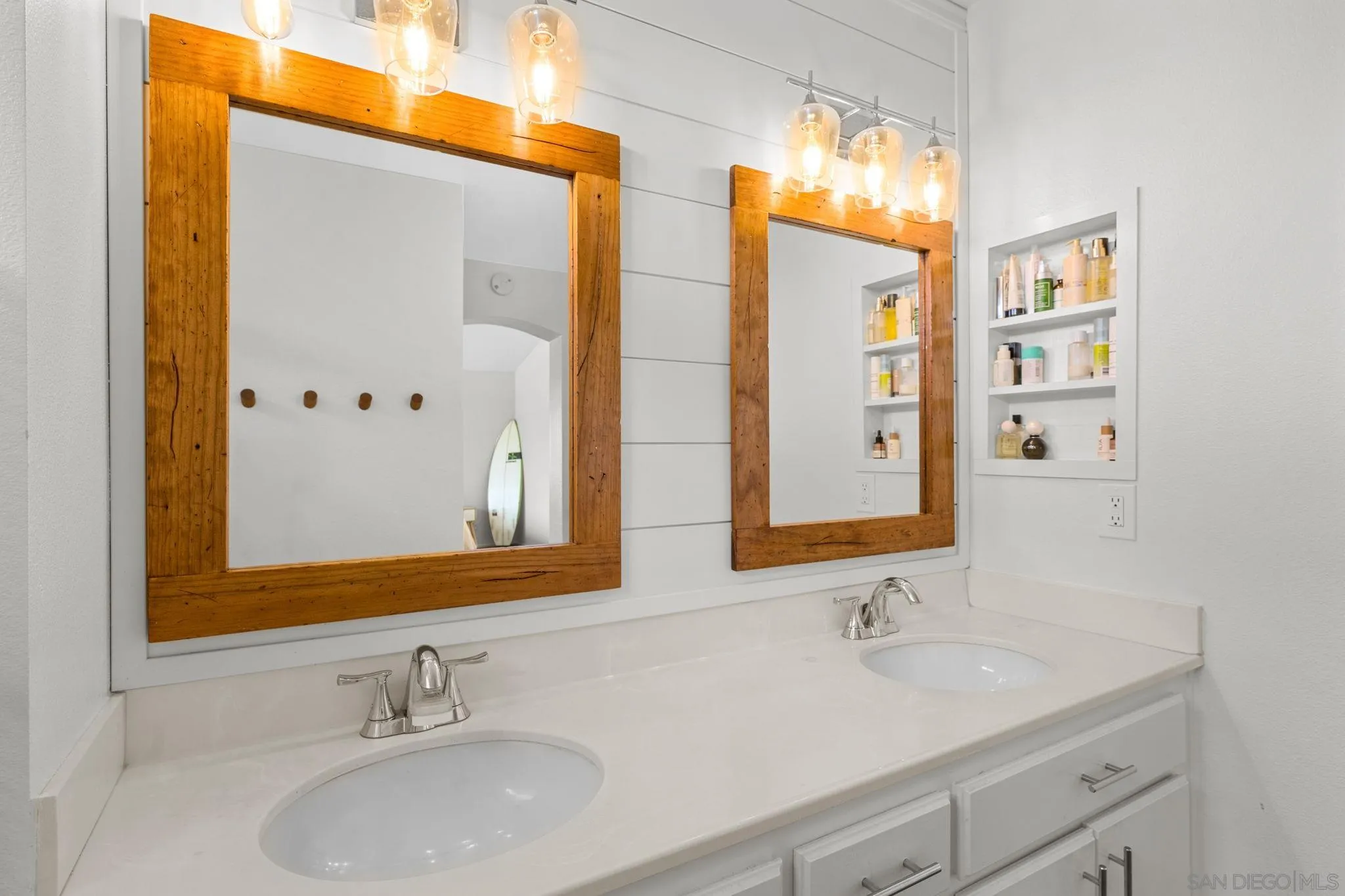 5392 Blackberry Way Oceanside, CA 92057 - Photo 29 of 37 a bathroom with double vanity sinks and a mirror
