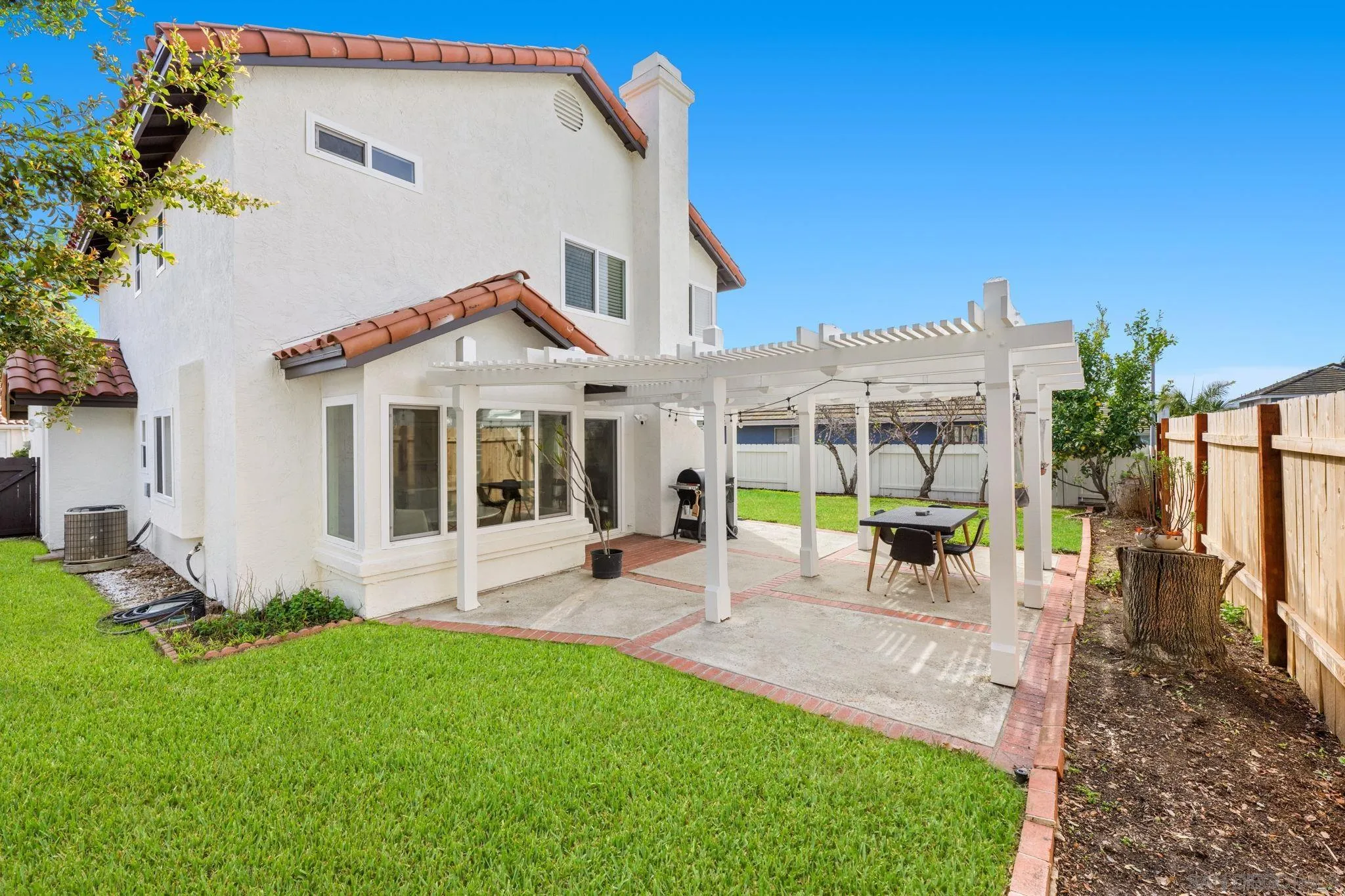 5392 Blackberry Way Oceanside, CA 92057 - Photo 34 of 37 a view of a house with backyard sitting area and garden