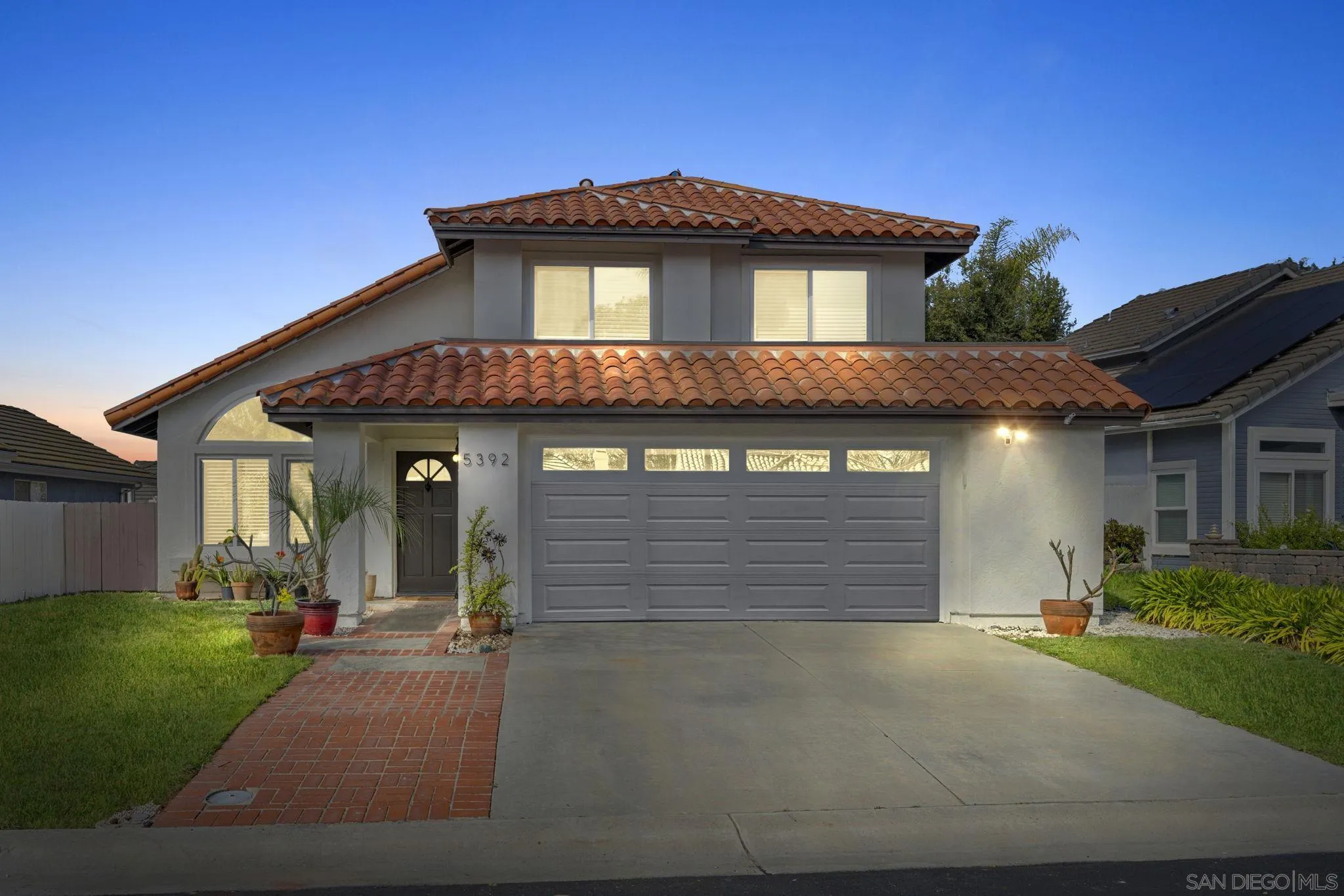 5392 Blackberry Way Oceanside, CA 92057 - Photo 36 of 37 a front view of a house with a yard and garage
