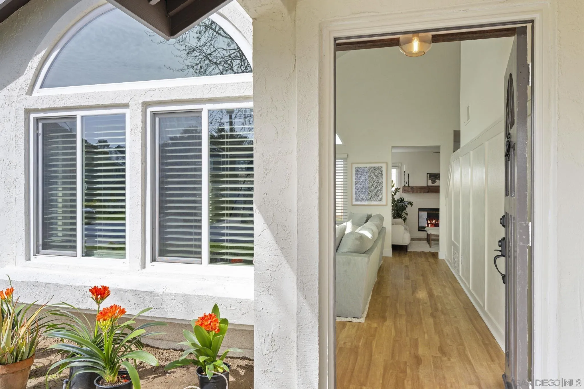 5392 Blackberry Way Oceanside, CA 92057 - Photo 4 of 37 a view of a bathroom with a window and a hardwood