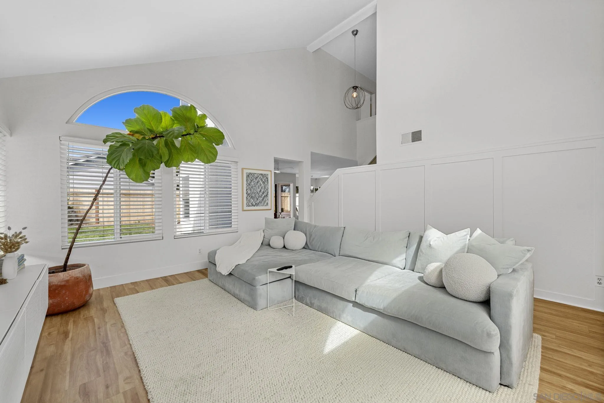 5392 Blackberry Way Oceanside, CA 92057 - Photo 7 of 37 a living room with furniture flowerpot and wooden floor