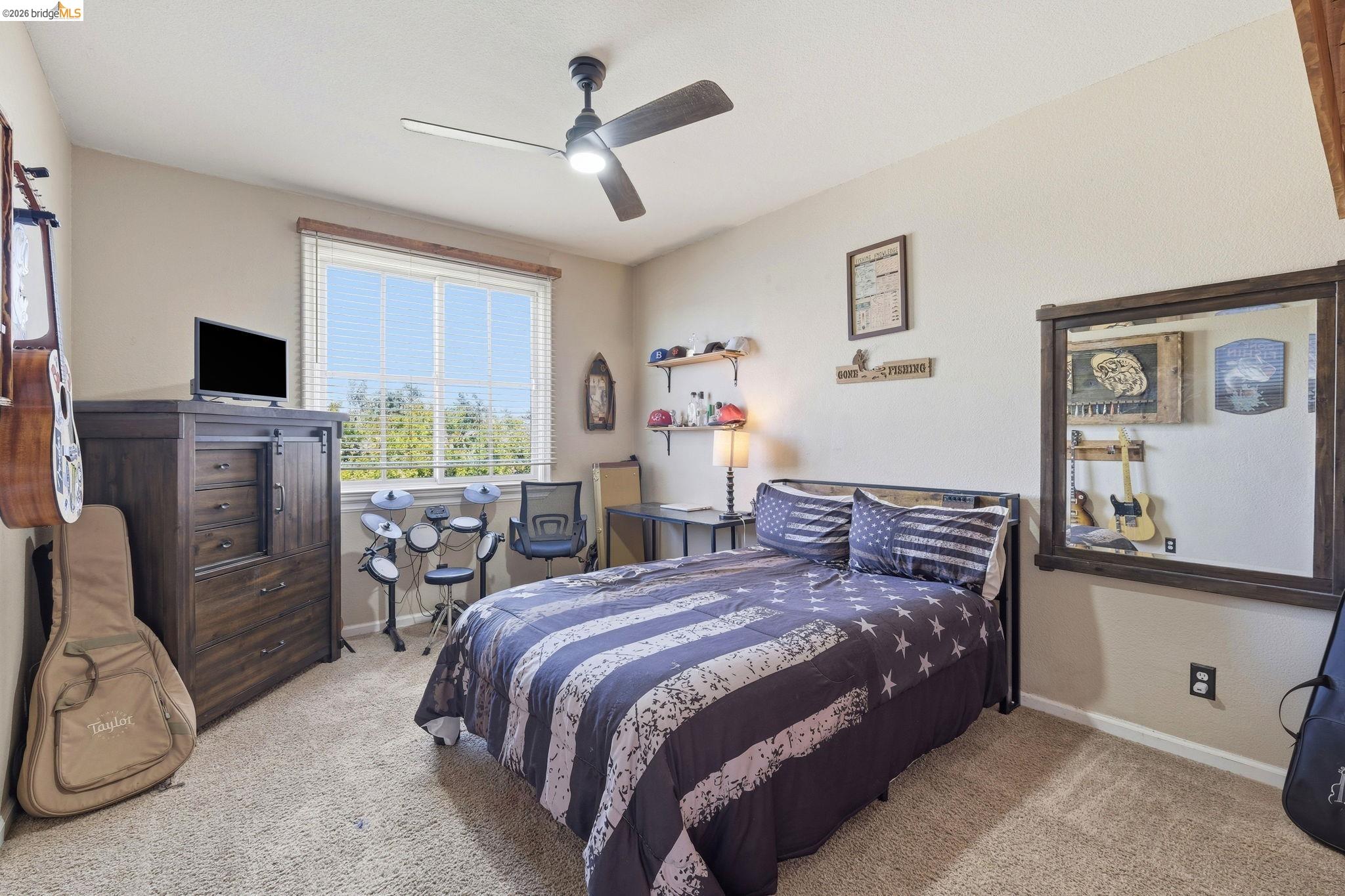 3438 Keystone Loop Discovery Bay, CA 94505 - Photo 35 of 57 a bedroom with a bed a couch and a flat screen tv