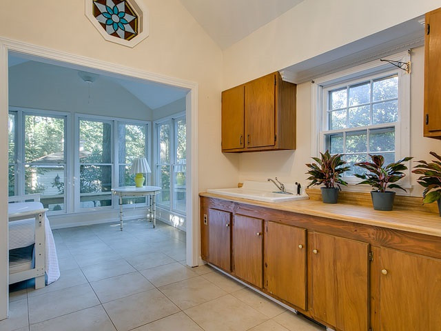 209 Avon Drive Raleigh, NC 27608 - Photo 10 of 20 This utility room has plenty of storage and counter space.