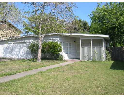 a view of a backyard with a garden and plants
