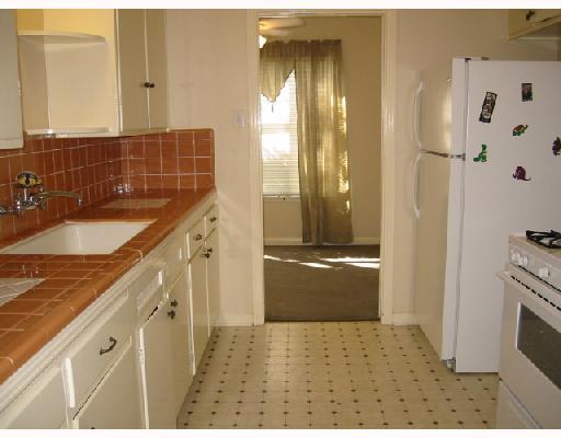 4416 Sequoia Street Corpus Christi, TX 78411 - Photo 2 of 6 a bathroom with a granite countertop sink a mirror and a shower