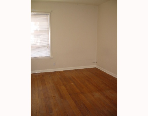 4416 Sequoia Street Corpus Christi, TX 78411 - Photo 5 of 6 a view of an empty room with wooden floor and a window