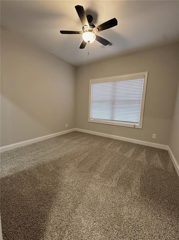 7217 King Road Valley, AL 36854 - Photo 9 of 14 Unfurnished room featuring carpet floors and a ceiling fan