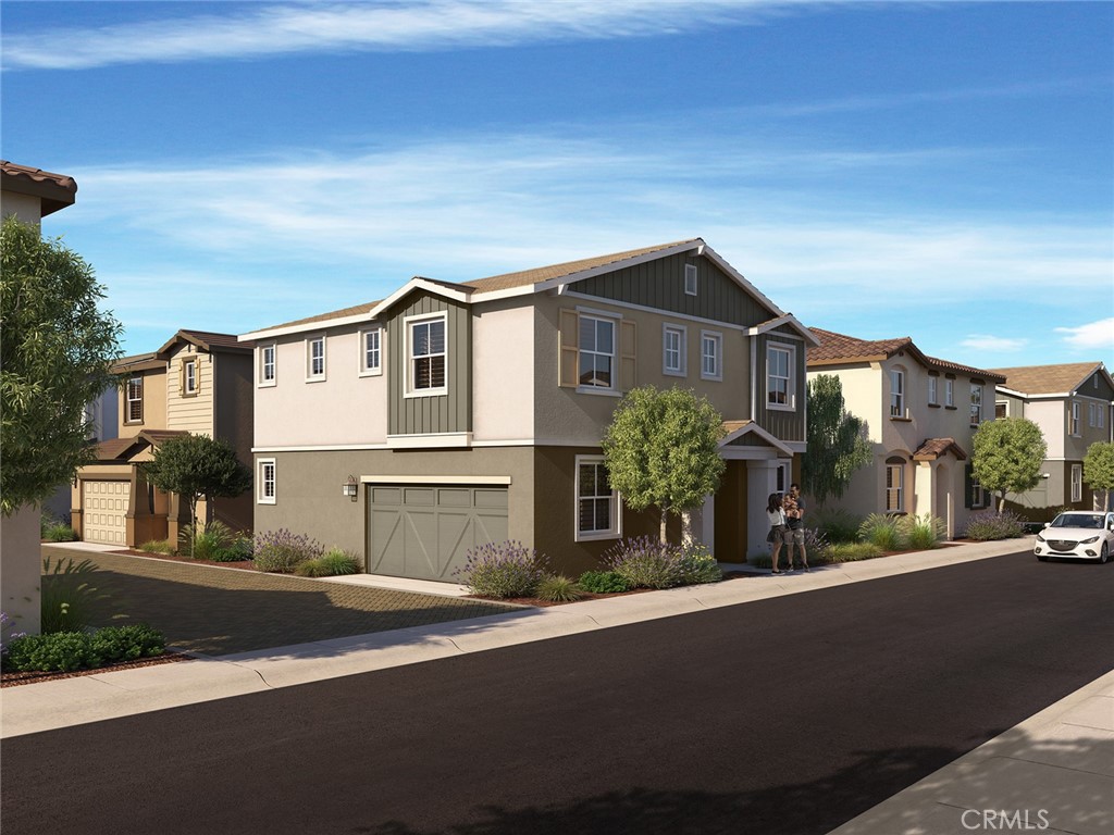 663 Joseph Privado Ontario, CA 91761 - Photo 11 of 13 a front view of a house with a yard and garage