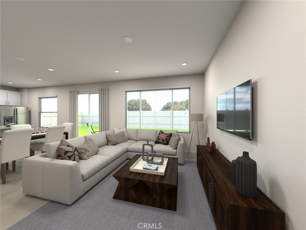 663 Joseph Privado Ontario, CA 91761 - Photo 5 of 13 a living room with furniture flat screen tv and a large window